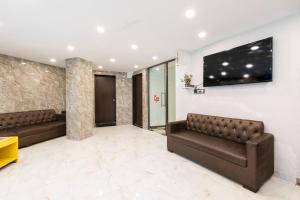 TV a/nebo společenská místnost v ubytování Hotel Girgoan Palace