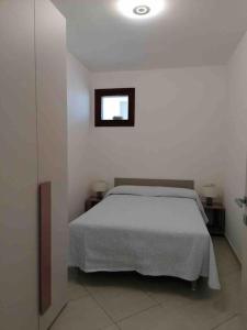 Ένα ή περισσότερα κρεβάτια σε δωμάτιο στο ACQUAMARINA Appartamento nuovo sul mare +14 φωτογραφίες