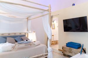 TV a/nebo společenská místnost v ubytování Oppure - Centro Città Spa & Relax