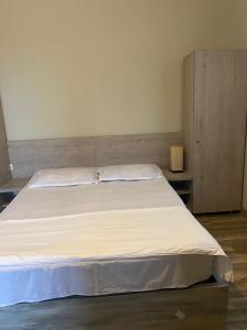 Postel nebo postele na pokoji v ubytování Hotel Amigo II