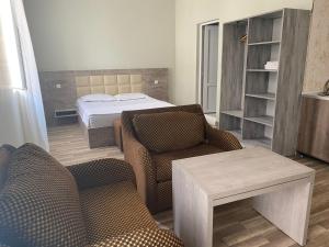 Postel nebo postele na pokoji v ubytování Hotel Amigo II