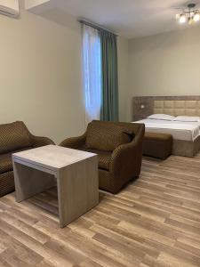 Postel nebo postele na pokoji v ubytování Hotel Amigo II