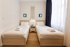 Postel nebo postele na pokoji v ubytování Stabu Sēta Residence