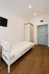 Postel nebo postele na pokoji v ubytování Stabu Sēta Residence