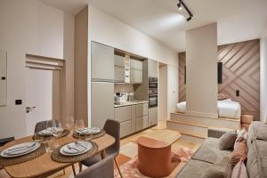 a living room with a couch and a table at Apartment Notre Dame de Paris by Studio prestige in Paris