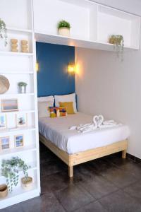 a bedroom with a bed in a book shelf at Cosy studio à 2 pas de la plage in Nice