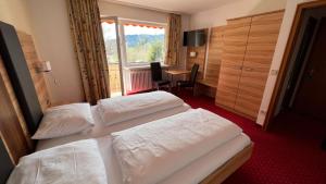 Postel nebo postele na pokoji v ubytování Hotel Silberfelsen