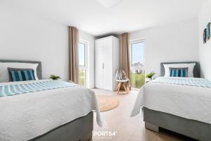 Postel nebo postele na pokoji v ubytování OstseeOase
