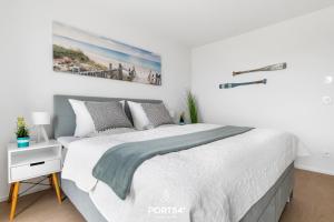 Postel nebo postele na pokoji v ubytování OstseeOase
