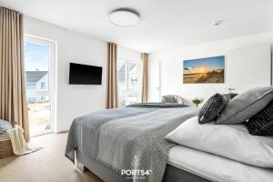 Postel nebo postele na pokoji v ubytování OstseeOase