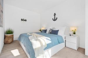 Кровать или кровати в номере Ferienwohnung Vogelsang, App 5 Emmelsbüll