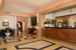 a lobby with a reception desk in a building at Grande Albergo in Sestri Levante