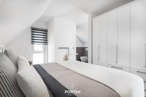 Voodi või voodid majutusasutuse Lille sort hus toas