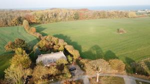 an aerial view of a house in the middle of a field at Hühnerstall Lüttenhof in Hasselberg