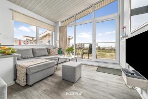 TV a/nebo společenská místnost v ubytování Ferienhaus Seemöwe Marina Wendtorf