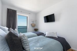 Postel nebo postele na pokoji v ubytování Ocean Lounge