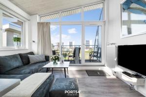 Et tv og/eller underholdning på Ferienhaus Lagunenblick 38 Marina Wendtorf