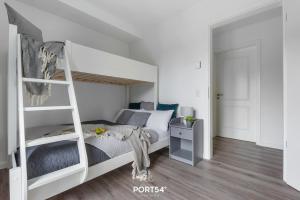 Postel nebo postele na pokoji v ubytování Ostseeoase Damp