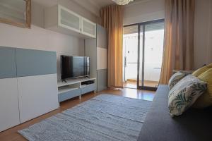 TV at/o entertainment center sa Jcmar Apartments - 100 m from the beach - free wifi - by bedzy