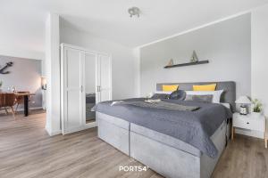 Postel nebo postele na pokoji v ubytování Meerzeit Damp