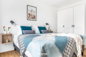 Ένα ή περισσότερα κρεβάτια σε δωμάτιο στο Lütte Strandhus