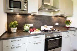 Kuchyň nebo kuchyňský kout v ubytování Meeresmelodie