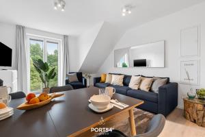 TV a/nebo společenská místnost v ubytování Ferienwohnung Hohe Wacht, App 15 Emmelsbüll