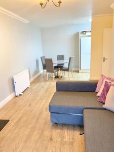 a living room with a couch and a table at Lovely 2 bedroom apartment in Dublin City in Dublin