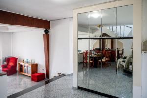 a room with a glass door leading to a dining room at Villa Mae in Elaiokhórion