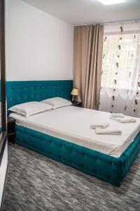 Ένα ή περισσότερα κρεβάτια σε δωμάτιο στο Hotel & MedSpa Siret