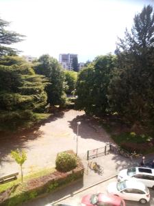 a parking lot with cars parked in a park at Kilian Campus UGA in La Tronche