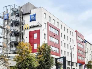a building with a sign on the side of it at ibis budget Paris Porte de Vanves in Vanves