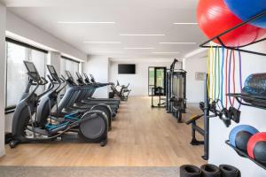 a fitness room with treadmills and cardio machines at Hyatt Regency Coralville in Coralville