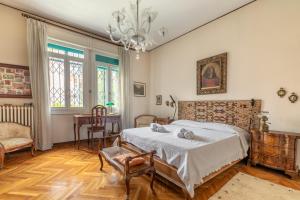 Tempat tidur dalam kamar di Casa Flores - 2 camere Padova