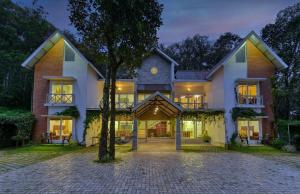 an exterior view of a house at Crayons Guest House Munnar in Munnar