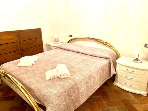 Ліжко або ліжка в номері Casa di Viola