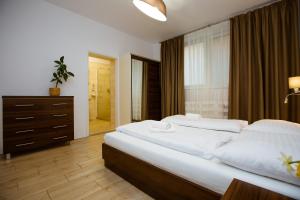 Postel nebo postele na pokoji v ubytování Hotel Litovel
