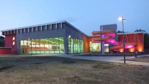 a building with a slide in front of it at Apartament in Nakło nad Notecią