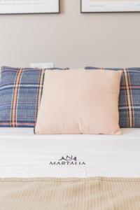 Łóżko lub łóżka w pokoju w obiekcie Apartamentos Martalia Áticos Deluxe