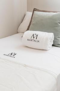 Łóżko lub łóżka w pokoju w obiekcie Apartamentos Martalia Áticos Deluxe
