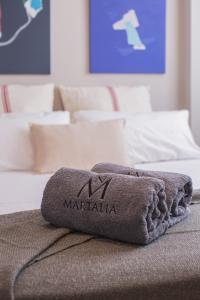 Łóżko lub łóżka w pokoju w obiekcie Apartamentos Martalia Áticos Deluxe