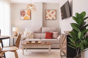 Telewizja i/lub zestaw kina domowego w obiekcie Apartamentos Martalia Áticos Deluxe