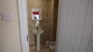 a bathroom with a sink and a toilet at Palm Beach Hotel in Bournemouth +45 photos