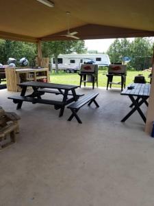 a group of picnic tables sitting under a tent at Sportsman's Lodge in Fairfield Bay
