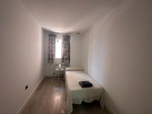 Ліжко або ліжка в номері Apartamentos Dos Torres Sindarin +6 фото