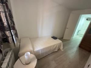 Ліжко або ліжка в номері Apartamentos Dos Torres Sindarin