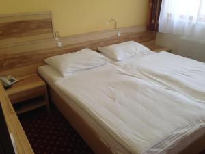 En eller flere senger på et rom på Hotel zum Kastell