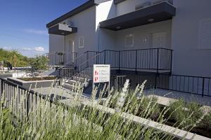 a building with a sign in front of it at Apartments Ragusa Palace 1 Djardin in Dubrovnik