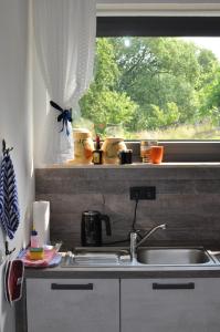 Kuchyň nebo kuchyňský kout v ubytování Apartment Am Eck