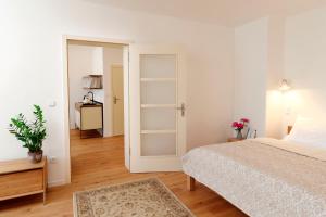 Posteľ alebo postele v izbe v ubytovaní Bonviván Apartments